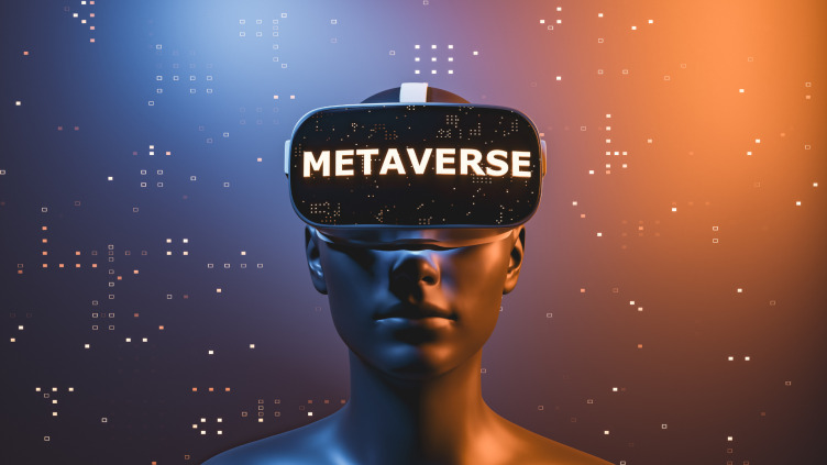图片展示了一个人戴着虚拟现实头盔，头盔上显示“METAVERSE”字样，背景为橙蓝渐变色，点缀着数字化元素。